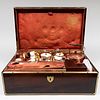 French Brass-Mounted Mahogany Cased Silver and Paris (Schoelcher) Porcelain Traveling Tea and Luncheon Service