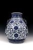 A Chinese Blue & White Pear Shaped Vase with Archaic Pierced Handles from the Qing Dynasty with a Six-Character Qianlong Mark on the Base.

H: Approxi