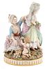 A Meissen Porcelain Figural Group Height 9 1/4 inches.