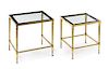 * French, SECOND HALF 20TH CENTURY, a set of two brass and glass nesting tables