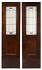 Attributed to William Eugene Drummond, (American, 1876-1948), a pair of American leaded-glass windows mounted in oak doors
