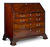 George III mahogany slant front desk, ca. 1765, with fretwork interior and carved ogee feet, 41 3/