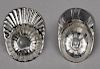Two English silver jockey cap tea caddy spoons, one marked for Birmingham 1799, the second unmarke