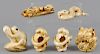 Six Japanese Meiji period carved ivory snake and frog netsukes.