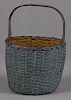 New England painted splint gathering basket, 19th c., with a fixed handle, retaining an old dry bl