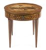 A Louis XVI Style Marquetry and Parquetry Inlaid Games Table, Height 30 1/8 x diameter 31 3/4 inches.