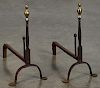 Pair of wrought iron andirons, late 18th c., with brass flame finials and penny feet, 19 1/2'' h.