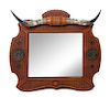 A Longhorn Tooled Leather Mirror Height 35 1/2 x width 39 1/2 inches.