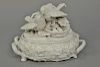 White covered dish having top with two unglazed porcelain birds and nest with four eggs on oval base with two vine handles (w