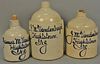 Three various size stoneware jugs, each marked in blue James M. Vandenbergh Highstown N.J. 11in. to 16 1/2in. Provenance: Col