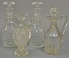 Four piece lot with four decanters including one pair and three with stoppers. ht. 11in. - 12 1/2in. Provenance: Collection o