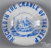 Blue enamel sailing ship paperweight on a white ground, inscribed Rocked In The Cradle Of The Deep