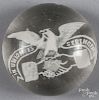 White frit paperweight, with an American Eagle sitting upon clasped hands, with a banner inscribed