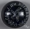 White frit paperweight, inscribed Gen. J. Wm. Hofman around a central star on a translucent cobalt