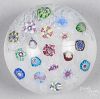 Contemporary Baccarat scattered millefiori paperweight on a white muslin ground, signed on base, 3 1