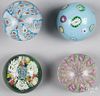 Four assorted paperweights, to include a crown patterned pedestal and a millefiori flower garden wei