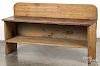 Pine bucket bench, probably constructed from old elements, 26 3/4'' h., 47 3/4'' w.