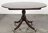 Baker Federal style mahogany dining table with two 20'' leaves, 30'' h., 54'' w., 45'' d.