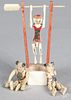 Miniature painted bone acrobat toy, 3 1/4'' h., together with two other acrobats.