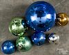 Group of seven glass kugel Christmas ornaments with embossed caps, largest - 6 1/2'' dia.