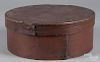 Painted bentwood box, 19th c., retaining its original red surface, 5 1/4'' h., 14'' w.