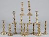 Large assortment of brass candlesticks, mostly English, late 19th/early 20th c.