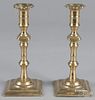 Pair of English Queen Anne brass candlesticks, 18th c., 8 1/2'' h.