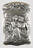 Gilbert sterling silver high relief embossed match vesta safe, with an image of three women holding