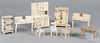 Nine pieces of Hubley and Arcade cast iron dollhouse furniture, tallest - 8''.