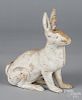 Cast iron rabbit doorstop, together with a duck pull toy, 11'' h.