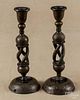 Two painted and gilt decorated wood candlesticks, 20th c., 12 1/4'' h.