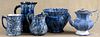 Four pieces of blue and white spongeware, 19th c., to include a jardinière and pitchers