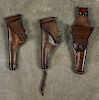 Three US Army leather holsters, including one inscribed Rock Island 1908, one G & K 1917, and