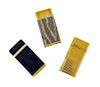 Three Gold-Plate Lighters, Cartier, Circa 1970, comprising one with vertically ribbed body and cover, another with horizontal ri