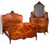 A CIRCA 1900 FRENCH CARVED WALNUT TWO-PIECE BEDROOM SET