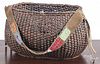 Oval basket with a leather beaded strap, 8" h., 11