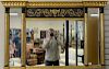 Federal style three part mirror, gilt and black painted with Pharaoh busts. 35" x 56"  Property from Credit Suisse's American