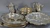 Group of silverplated items to include four large trays (lg. 17in. to 27in.), revolving center dish (lg. 20in.), covered ture