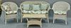 Four piece wicker set including loveseat (lg. 55in.), two armchairs, and a coffee table.