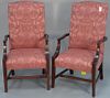 Pair of rose upholstered lolling chairs.