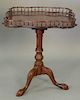 Mahogany gallery top tip table, late 20th century (gallery loose on one side). ht. 31in., top: 32" x 32"