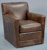 L & J.G. Stickley Cohiba leather swivel armchair.