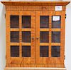 Small tiger maple hanging cabinet with two glass doors, signed on back. ht. 15 1/2in.