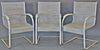 Four piece group including three white outdoor spring chairs and a bench with slate top. lg. 48in.