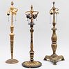 Three Gilt and Patinated-Metal Columnar Lamps, Possibly Elkington