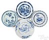 Four Delftware plates/shallow bowls, mid 18th c.