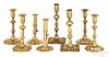 Four pairs of English brass candlesticks