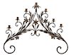 A Continental Wrought Iron Seven-Light Wall Sconce Height 26 x width 30 1/2 inches.