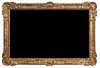 A Monumental Carved Giltwood Framed Mirror Height 54 1/2 x width 81 inches.