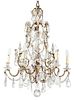 A Louis XV Style Gilt Bronze and Crystal Six Light Chandelier Height 34 x diameter 24 inches.